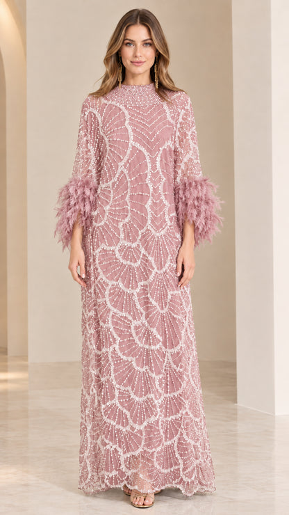 Front view of dusty pink sequin beaded maxi dress with matching feather cuffs