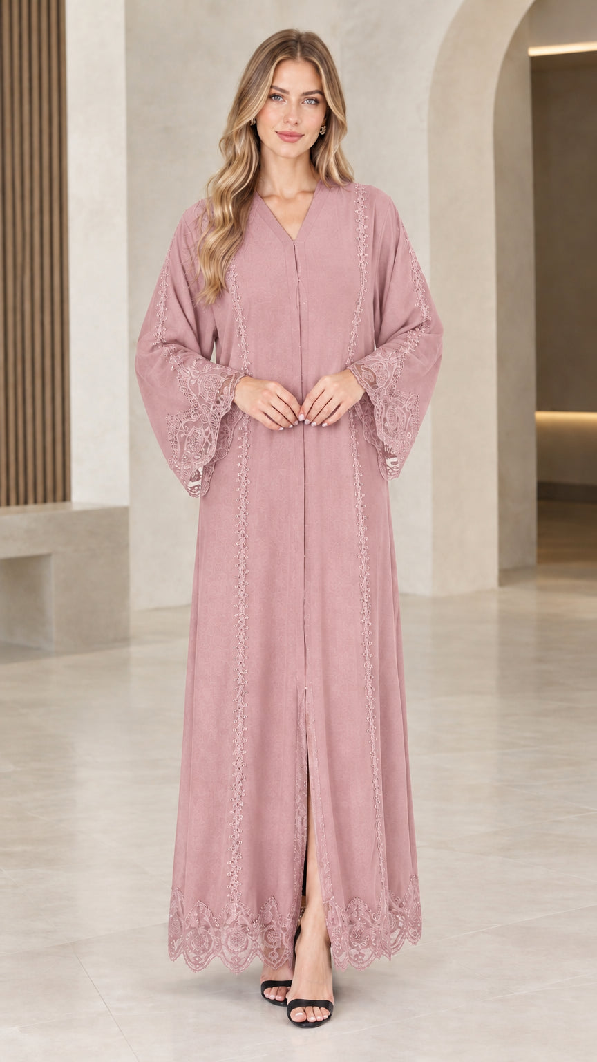 Front view of woman wearing dusty pink lace trim maxi abaya dress