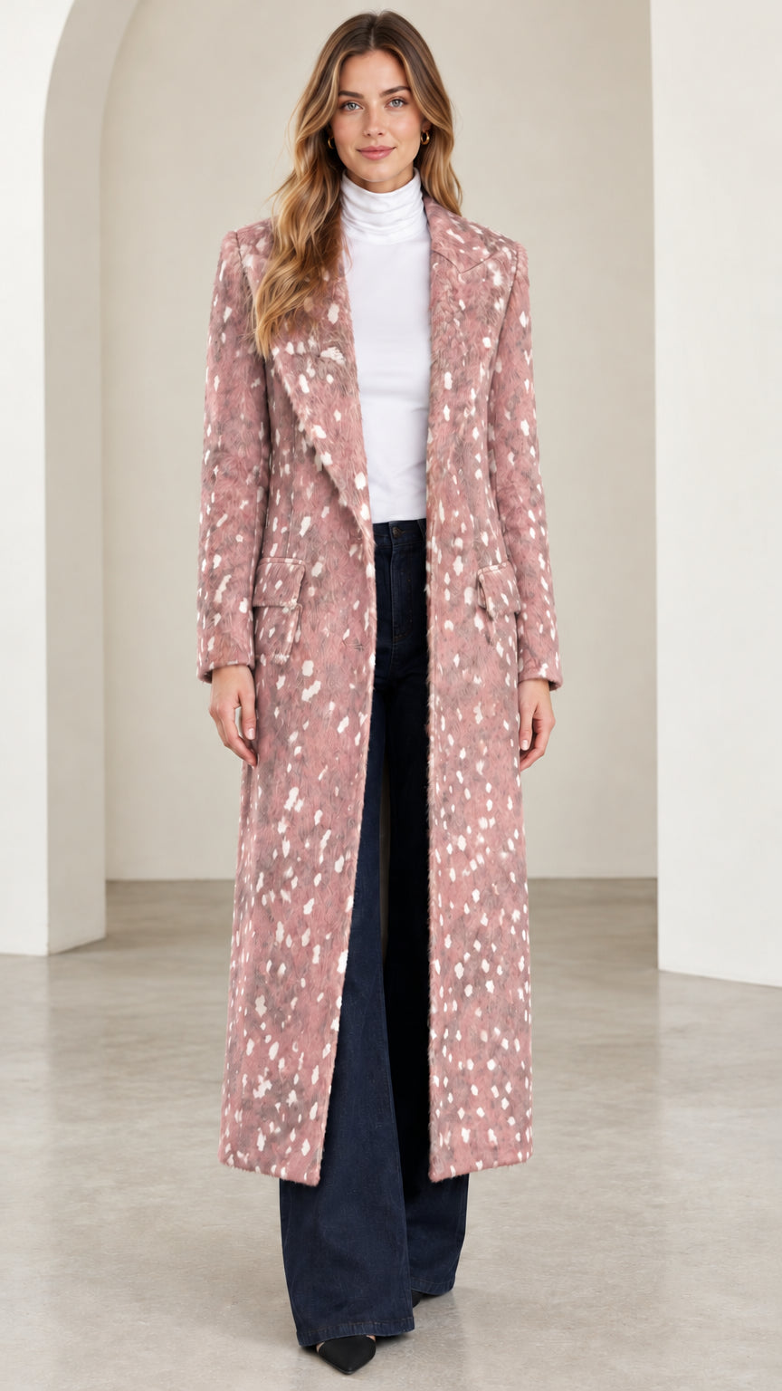 Front view of woman wearing dusty pink speckled tailored maxi coat