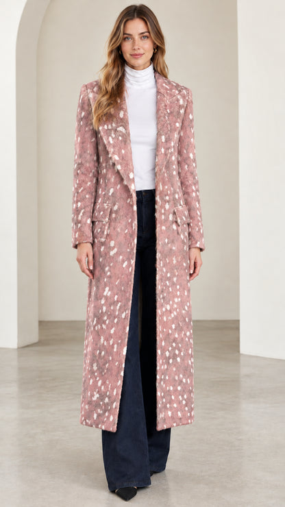 Front view of woman wearing dusty pink speckled tailored maxi coat
