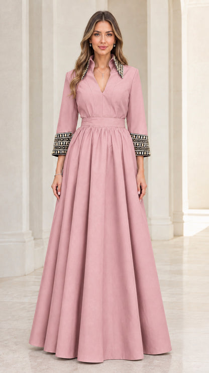 Front view of model wearing dusty pink embellished collar formal maxi dress