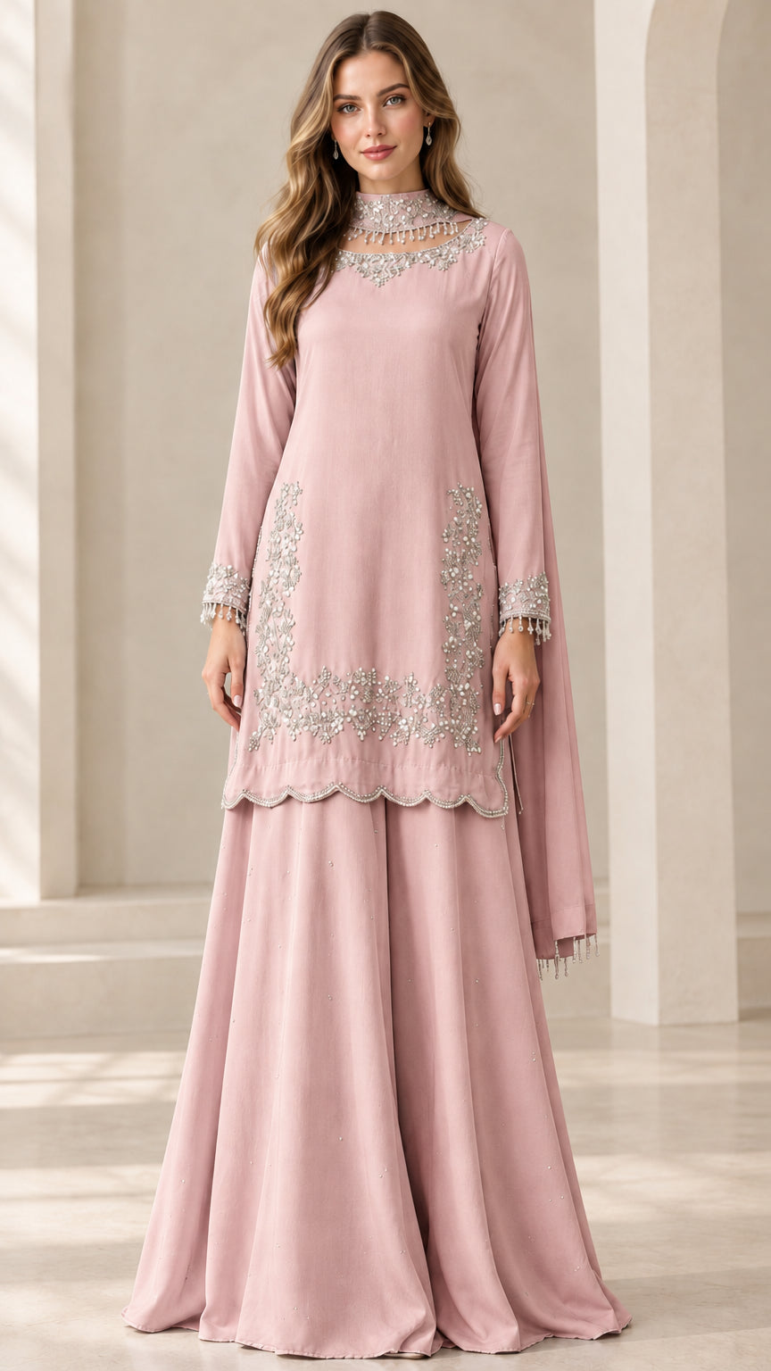 Full-length view of woman wearing Dusty Pink embroidered sharara suit set