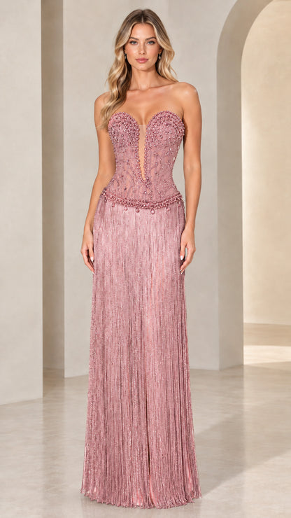 Front view of model wearing Blush Pink strapless beaded corset fringe evening gown