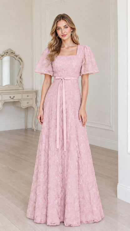 Full-length blush pink floral embroidered A-line maxi dress with waist tie