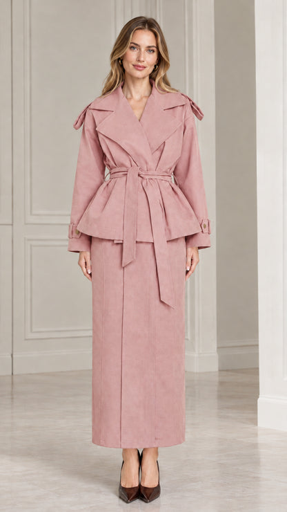Front view of model wearing dusty pink belted peplum jacket and maxi skirt set