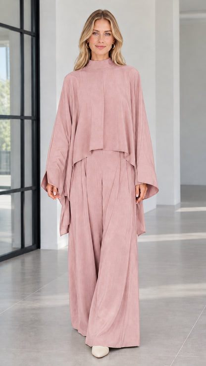 Front view of dusty pink draped cape top and matching wide leg trousers