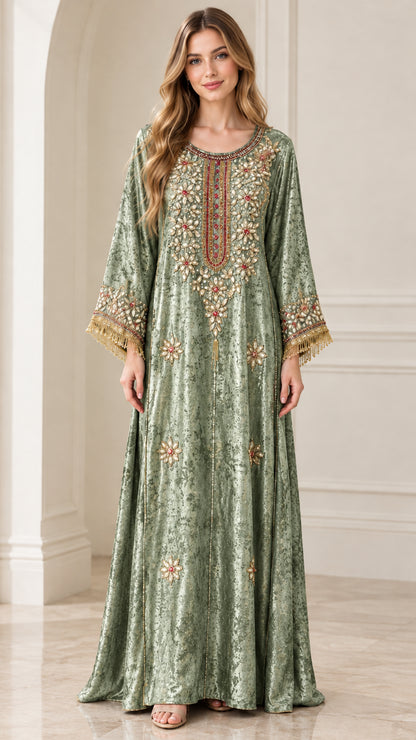 Front view of sage green embroidered velvet kaftan dress with tassels