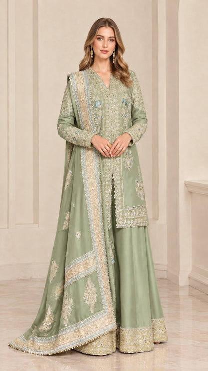Full-length studio portrait of woman wearing Sage Green embroidered sharara suit set