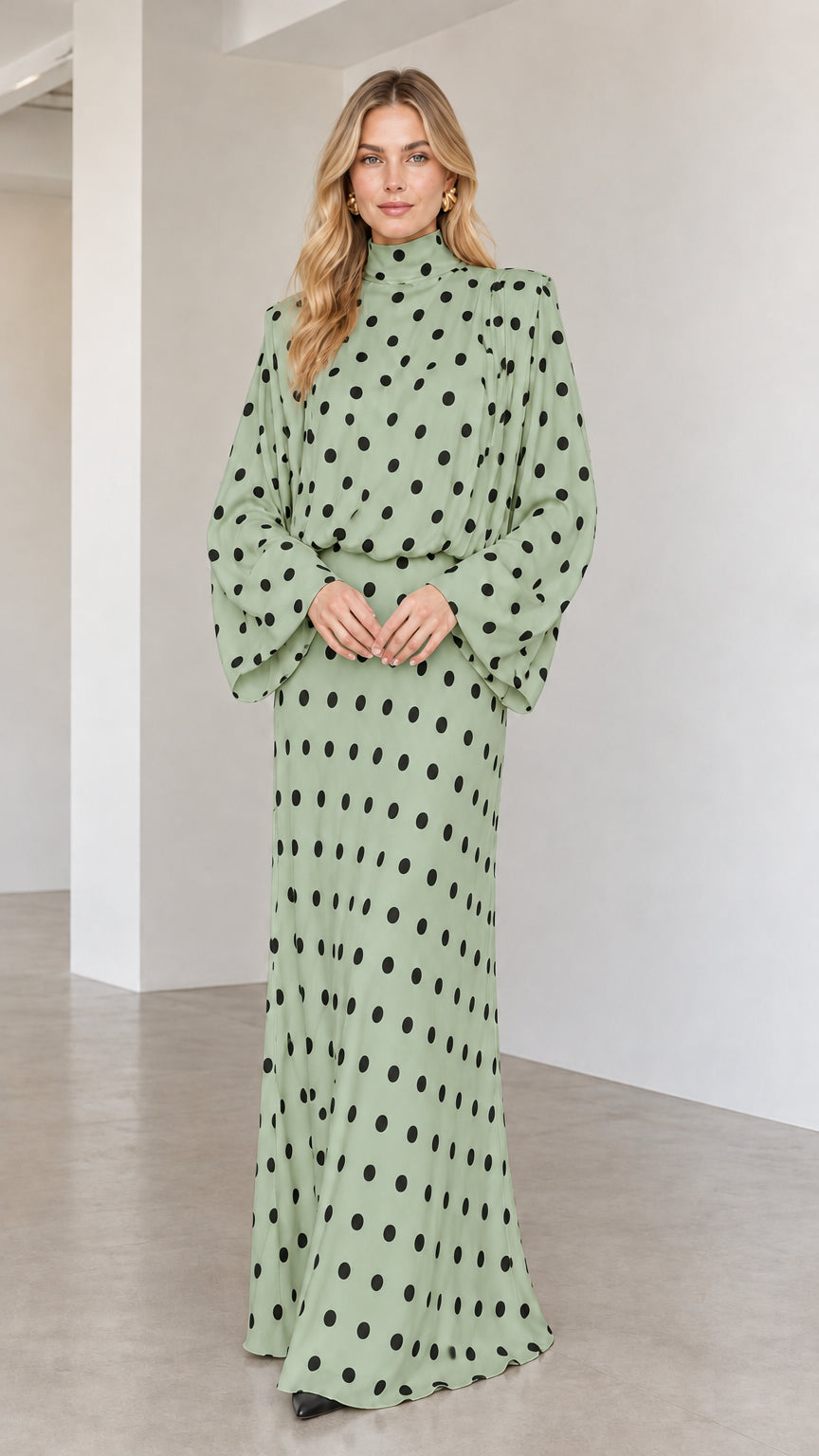 Model wearing sage green polka dot long sleeve high neck maxi dress