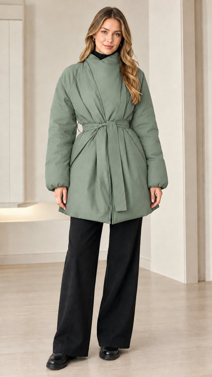 Model wearing sage green belted padded jacket with high wrap collar