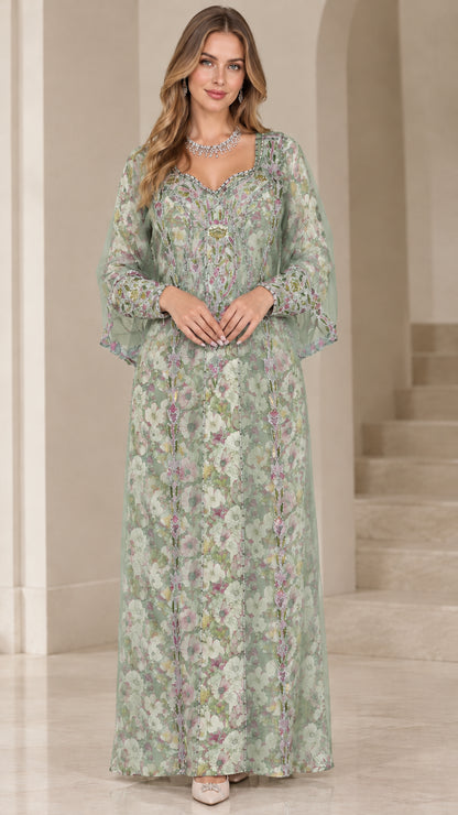 Front view of woman wearing sage green floral embroidered kaftan maxi dress