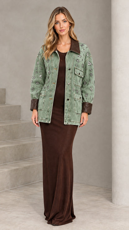 Front view of model wearing Sage Green embellished denim jacket with brown contrast trim