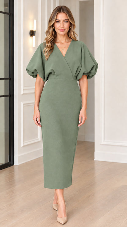 Front full view of woman wearing sage green V-neck puff sleeve midi sheath dress