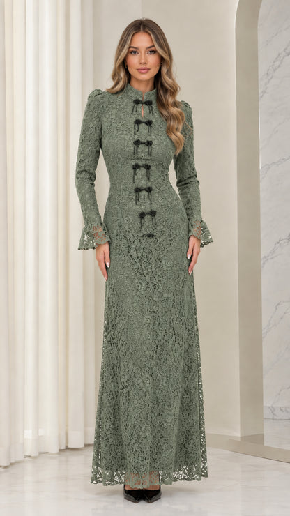 Front full view of woman wearing sage green floral lace long-sleeve maxi dress
