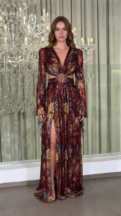 Model wearing Burgundy Multi metallic plissé cutout long sleeve evening gown