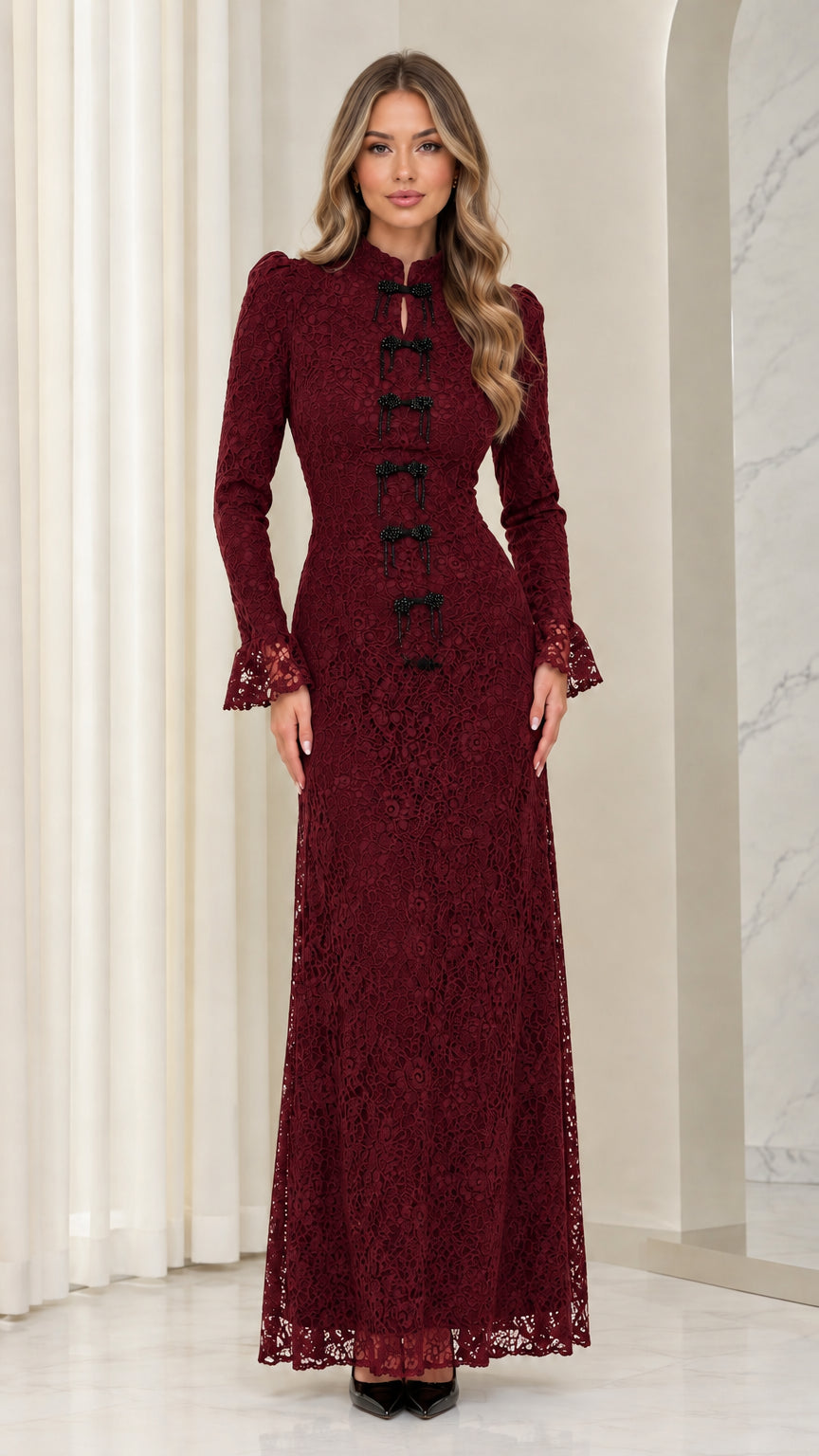Front full view of woman wearing burgundy floral lace long-sleeve maxi dress