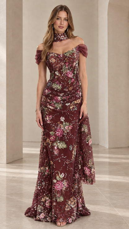 Front view of model wearing Burgundy floral embroidered beaded formal gown