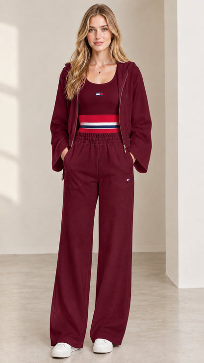 Women's 3-piece lounge set in burgundy wine red with cropped hoodie, tank, and wide leg pants