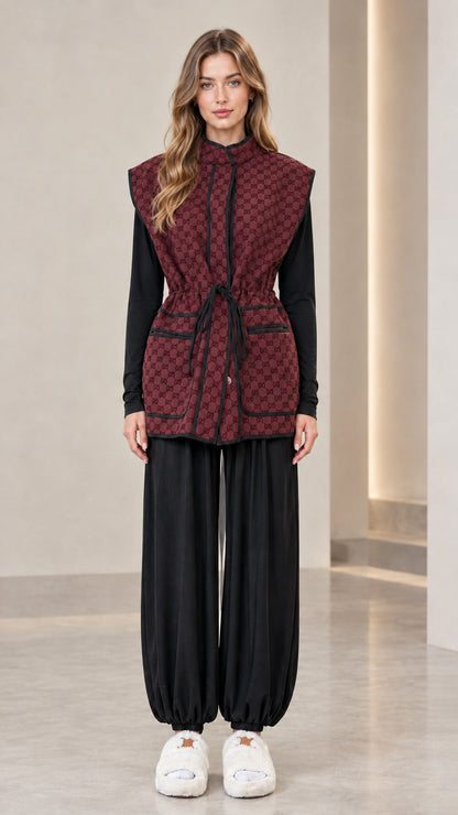 Full front view of woman wearing burgundy monogram drawstring waist vest