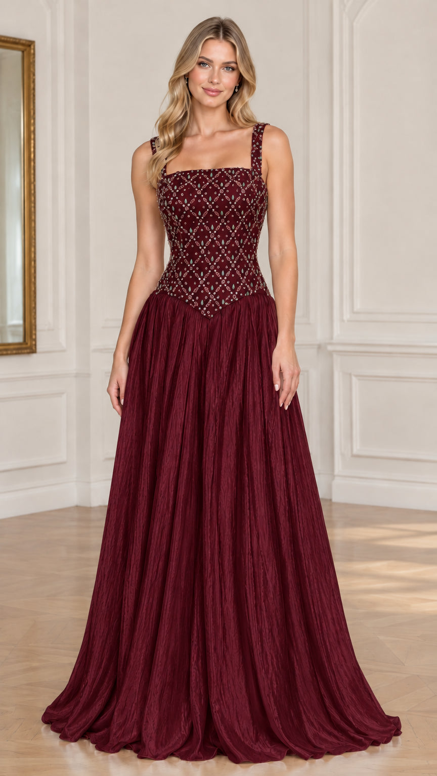 Model wearing burgundy red embellished basque waist evening gown