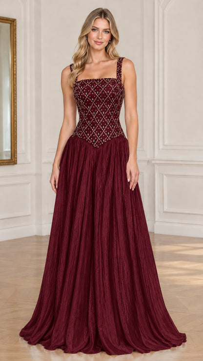 Model wearing burgundy red embellished basque waist evening gown