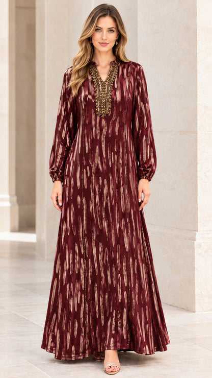 Front view of woman wearing Burgundy beaded long sleeve maxi dress
