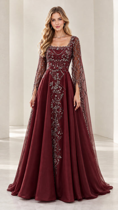 Woman wearing burgundy wine red beaded A-line formal gown with cape sleeves