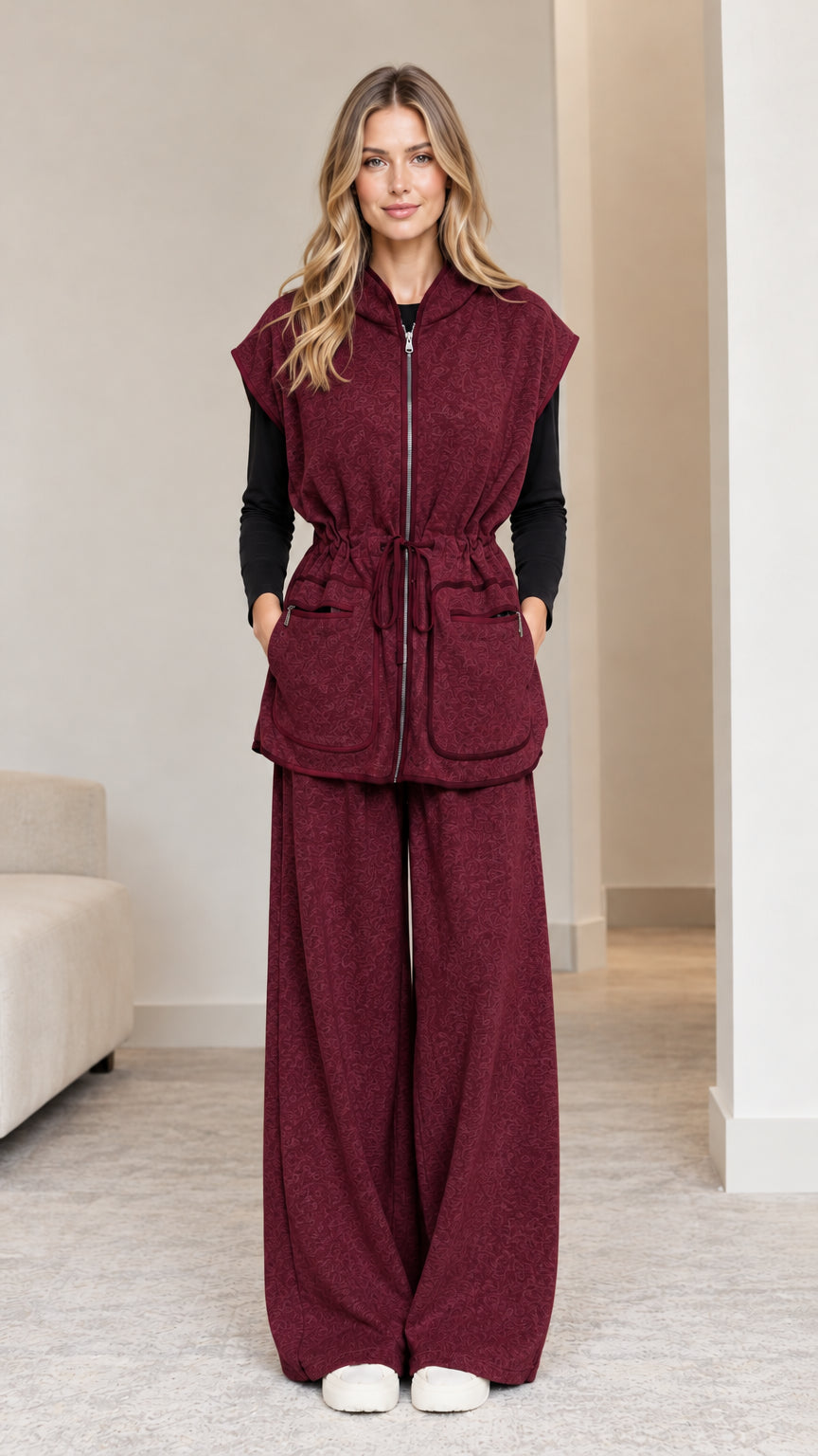 Model wearing burgundy wine 2-piece hooded vest and wide-leg pants set