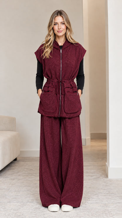 Model wearing burgundy wine 2-piece hooded vest and wide-leg pants set