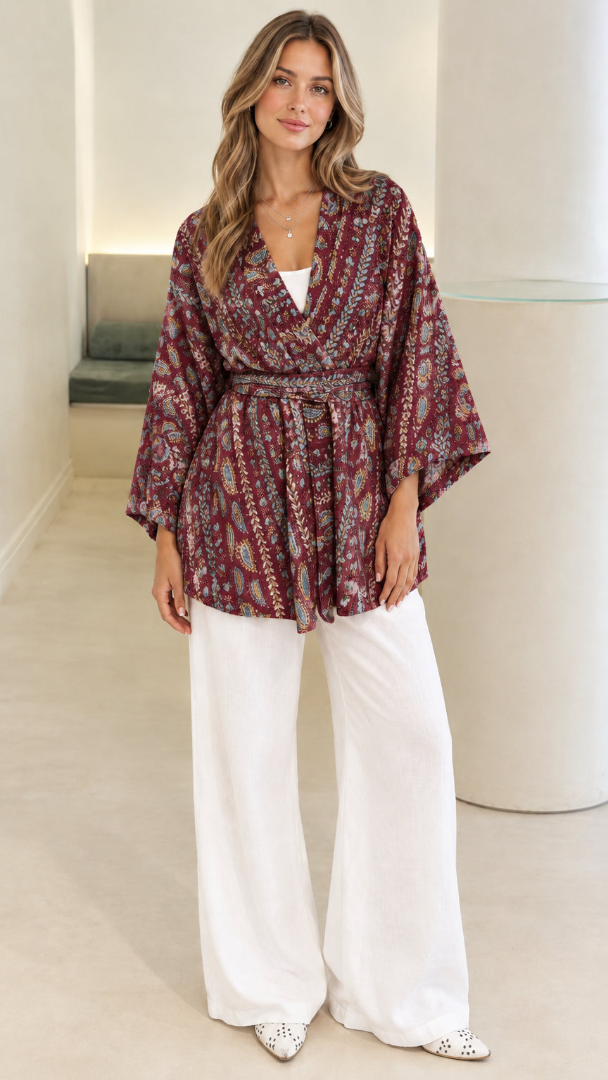 Front view of burgundy red paisley print belted kimono cardigan blouse