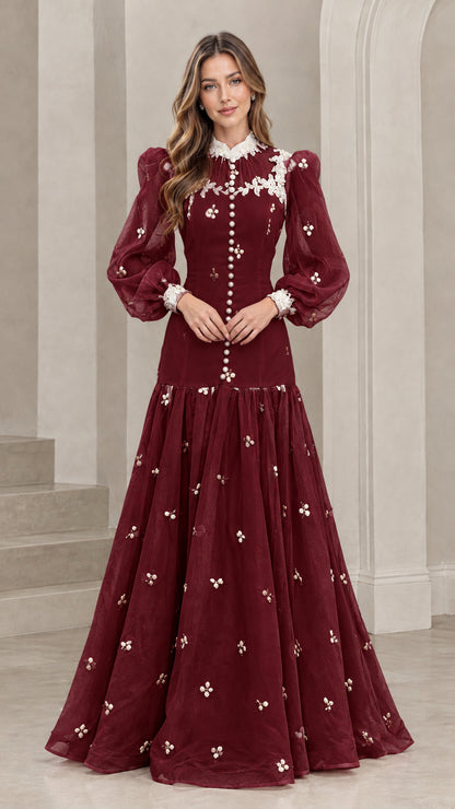 Front view of burgundy red long sleeve Victorian lace maxi gown with white lace details