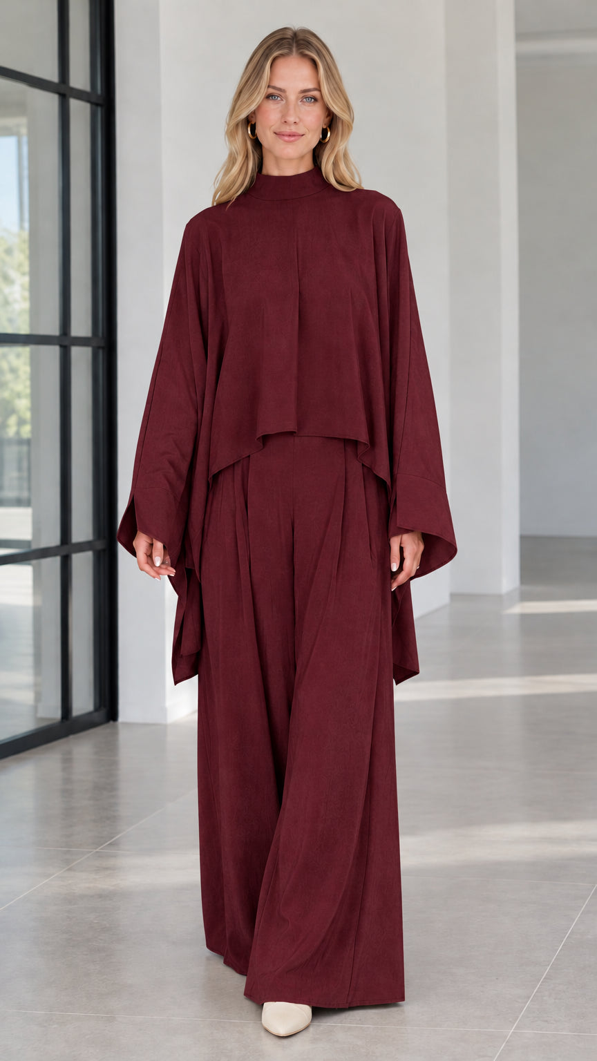 Front view of burgundy red cape sleeve top and wide leg pants two piece set
