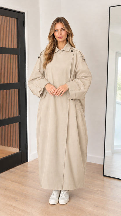 Full-length front view of beige sand longline trench coat on model