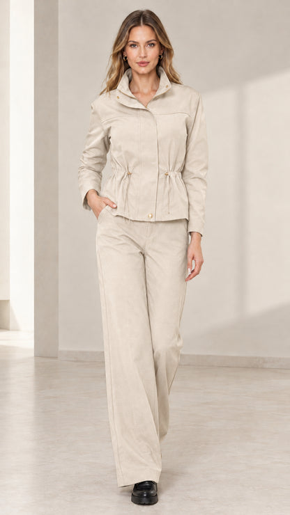 Model wearing Beige utility jacket and matching wide-leg trousers set