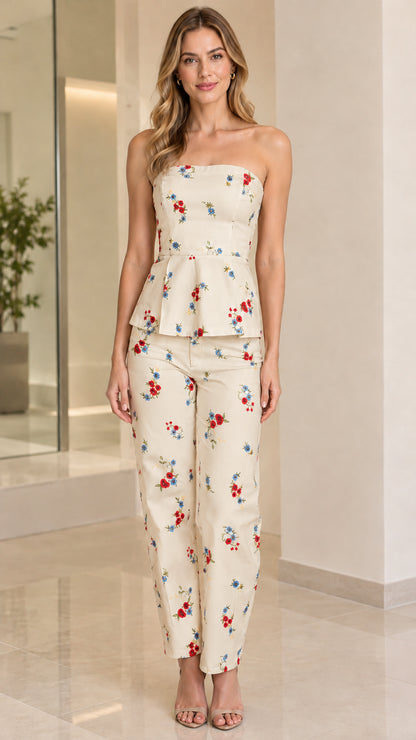 Full-length view of model wearing cream floral strapless peplum pant set