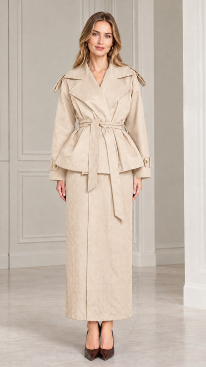 Front view of model wearing beige cream belted peplum jacket and maxi skirt set