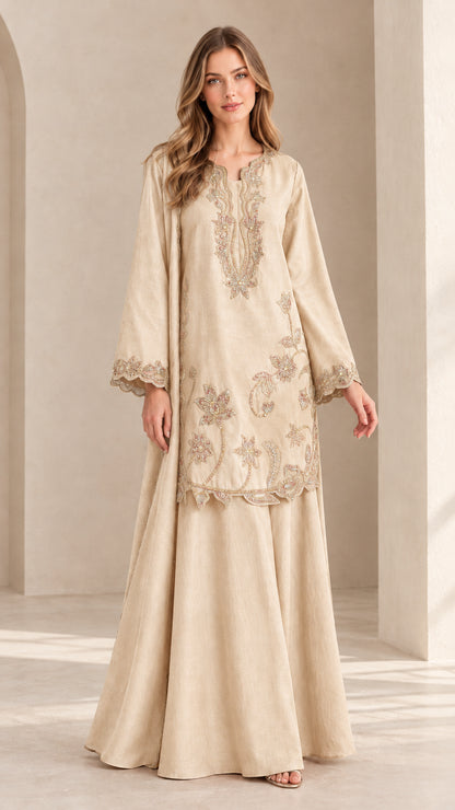 Full front view of model in champagne beige embroidered tunic and maxi skirt set