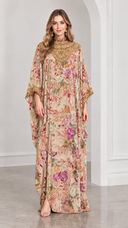 Front view of beige champagne floral velvet kaftan dress with gold details